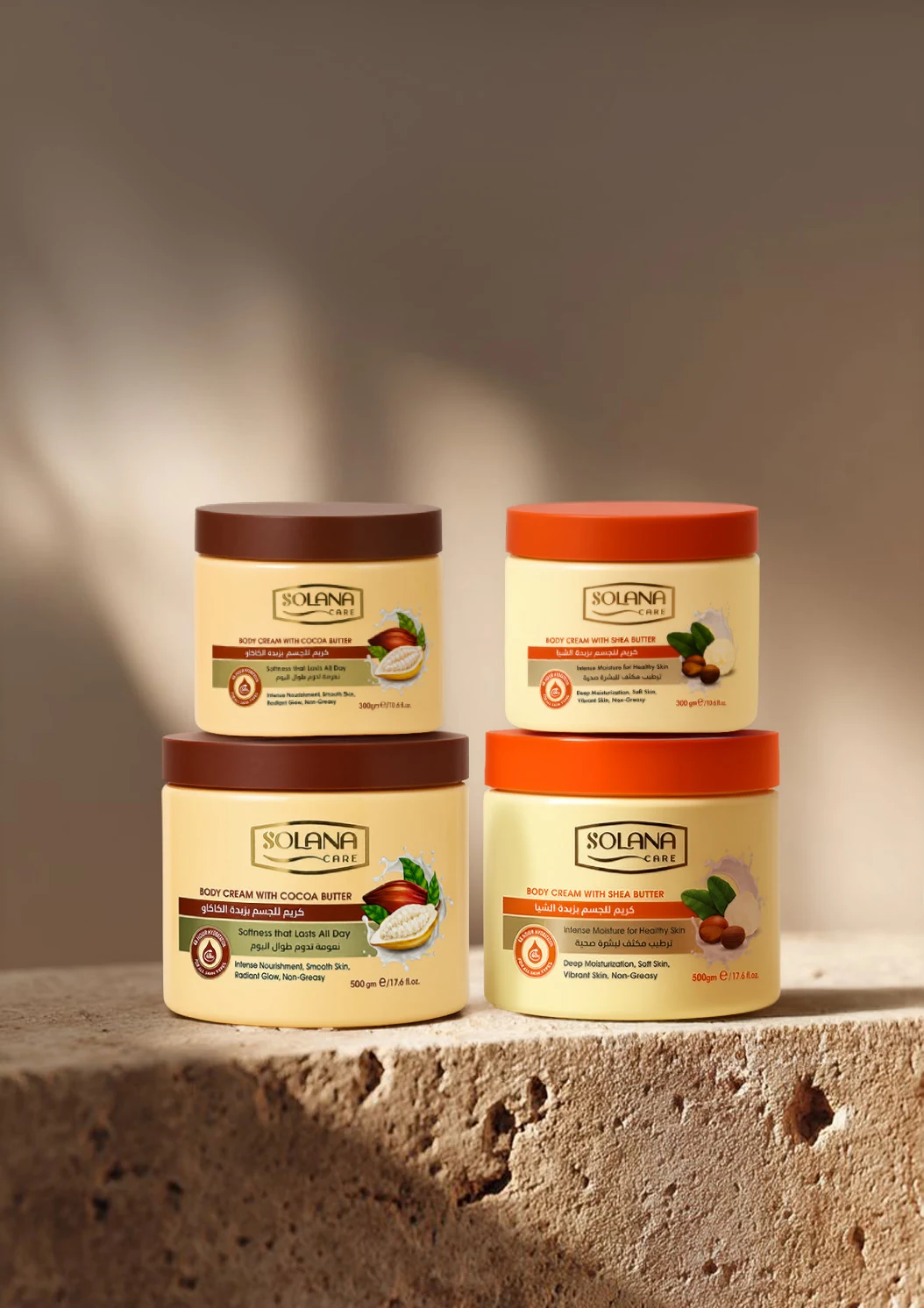 Historical Solana Care cocoa and shea body cream jars on a stone ledge, labeled in g; the current approved range uses ml